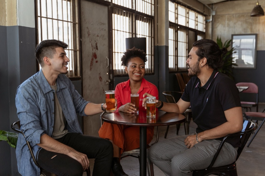 Friends sharing drinks at a bar
