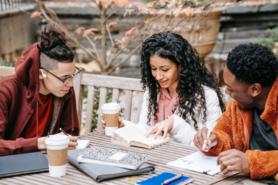 Friends relaxing together over coffee outdoors