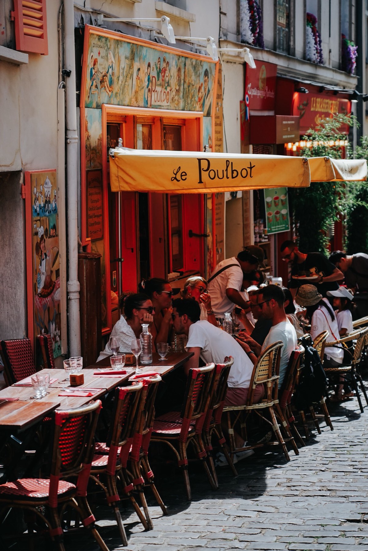 A lively restaurant terrace full of people