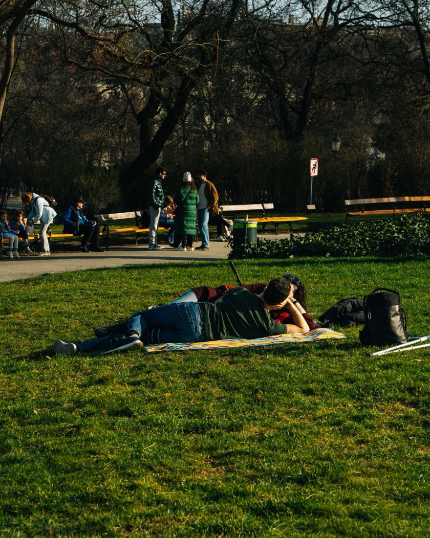 A couple sharing a quiet moment on a park picnic